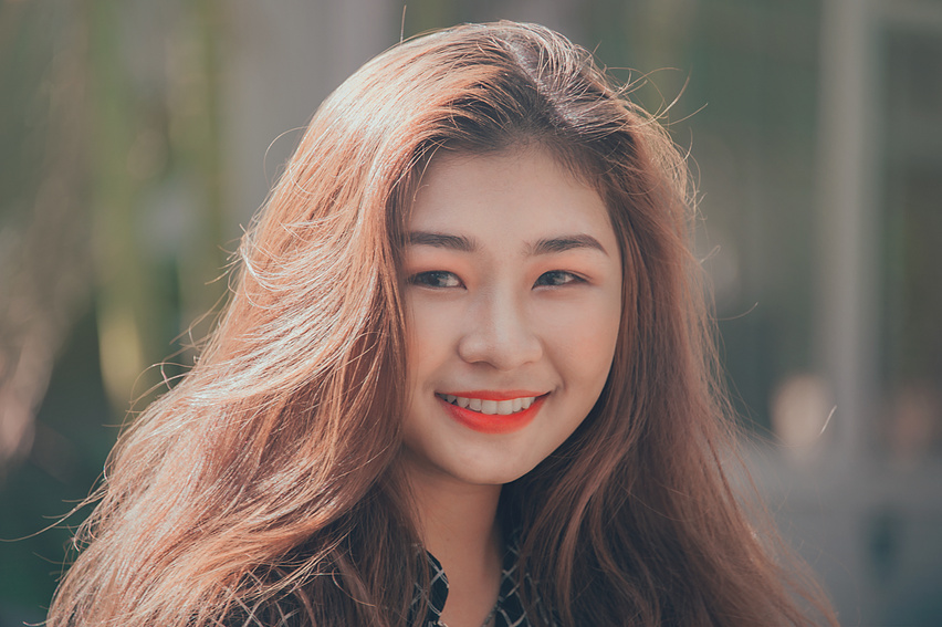 Woman Smiling Wearing Red Lipstick